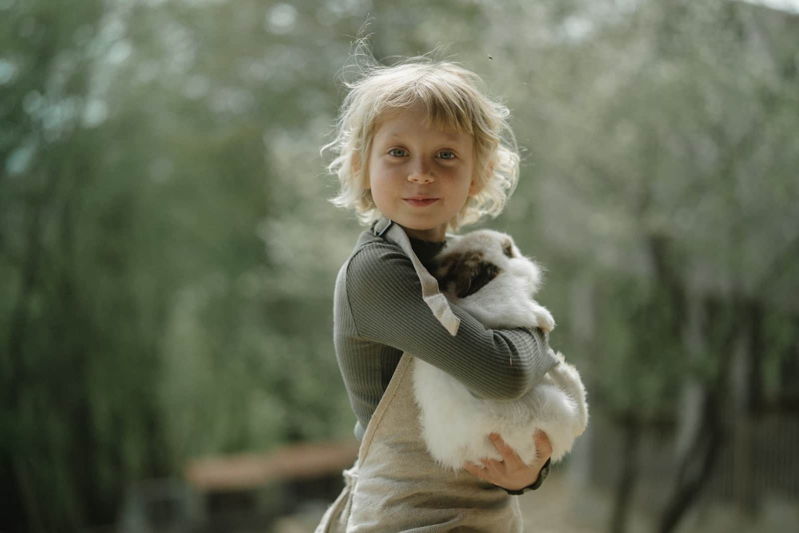 Child Carrying A Rabbit, Small Pets For Kids